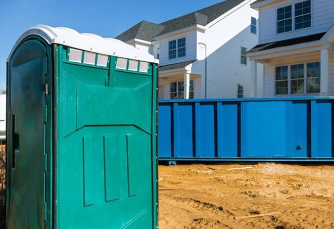 workers at a job site take advantage of convenient porta potties